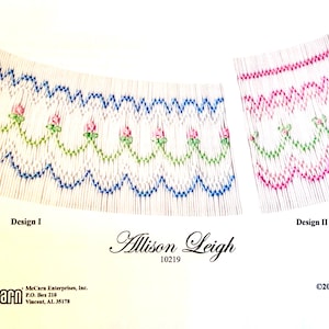 May include: Two smocked fabric designs, labeled Design I and Design II, featuring floral and scalloped patterns. Design I has blue and green accents, while Design II uses pink and green. The designs are labeled "Allison Leigh 10219".