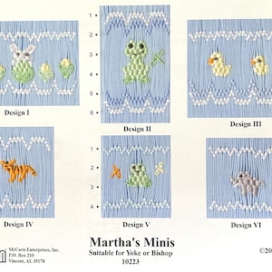 May include: A collection of six embroidered designs on light blue fabric, featuring various animal and floral motifs. Designs include a rabbit, frog, ducklings, tiger, and elephant. The text "Martha's Minis" is also visible.