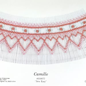 May include: A white paper pattern with a detailed design in red and black. The pattern features a repeating heart and floral motif. The text "Camille" and "Sew Easy" are visible.