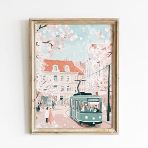 May include: A vintage-style illustration of a green streetcar traveling through a city street lined with pink buildings and blooming cherry blossom trees. People are walking on the sidewalk and the street is filled with pink petals.