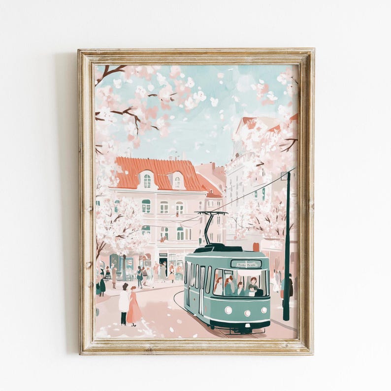 May include: A vintage-style illustration of a green streetcar traveling through a city street lined with pink buildings and blooming cherry blossom trees. People are walking on the sidewalk and the street is filled with pink petals.