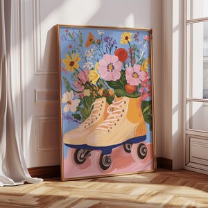 May include: A pair of yellow roller skates with white laces are surrounded by a bouquet of colourful flowers on a blue background. The flowers include pink, red, yellow, white, and purple blooms.