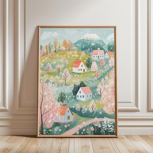 May include: A colorful illustration of a small village nestled in a green valley with blooming trees and a mountain range in the background. The houses are white with red roofs and blue windows. The trees are a mix of green and pink.