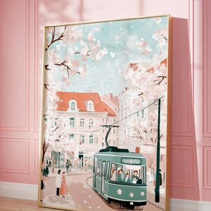 May include: A vintage-style illustration of a city street scene with a green tram, pink buildings, and cherry blossom trees. The tram is filled with passengers and is traveling down a street lined with trees. The sky is a light blue with white clouds.
