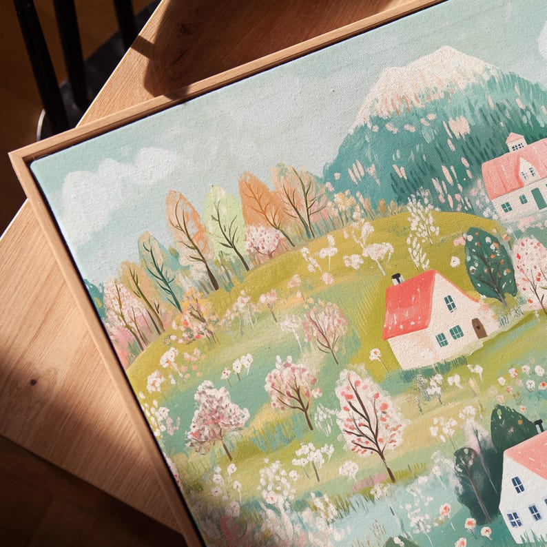May include: A painting of a whimsical village nestled in a green valley with a snow-capped mountain in the background. The houses are painted in soft colors with red roofs and white trim. The trees are a mix of green and pink, and there are flowers blooming in the fields.