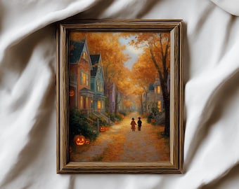 May include: A framed autumn-themed print depicts a street lined with colorful houses and trees with orange foliage. Two figures walk down a leaf-covered path. Lit jack-o'-lanterns sit in front of the houses, creating a Halloween atmosphere.
