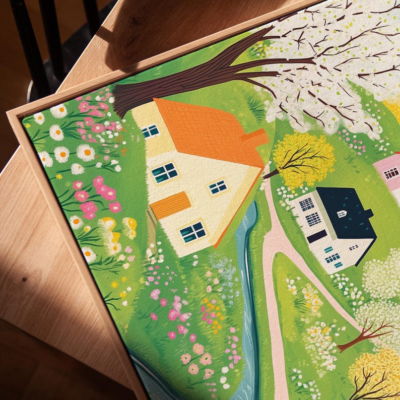 May include: A colorful illustration of a quaint countryside scene with two houses, a winding stream, and blooming flowers. The houses are painted in shades of yellow and white with orange roofs. The stream is a vibrant blue, and the flowers are a mix of pink, white, and yellow.