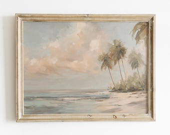 May include: A framed landscape painting depicts a serene beach scene. The artwork features palm trees, a sandy shore, and gentle waves under a cloudy sky. The color palette includes soft blues, beige, and muted greens, creating a calming atmosphere.