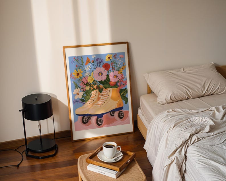 May include: A framed print of a painting depicting a pair of roller skates with a bouquet of colourful flowers in a yellow vase. The background is a light blue.