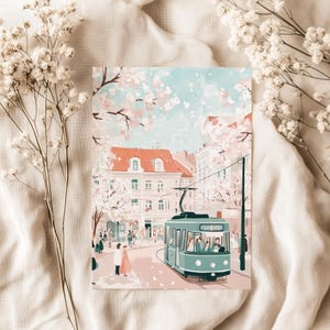 May include: A vintage-style green tram travels down a street lined with buildings and cherry blossom trees. The scene is painted in a soft, pastel color palette.