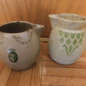 May include: A rustic wooden sign with the text "Welcome to our home" in white lettering. The sign features a distressed finish and a simple, inviting design, perfect for entryway decor.