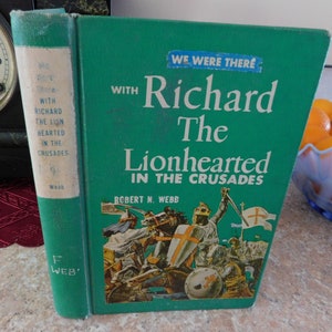 May include: A vintage hardcover book titled "We Were There With Richard The Lionhearted In The Crusades" by Robert N. Webb. The book has a green cover with white lettering and a colorful illustration of knights on horseback.