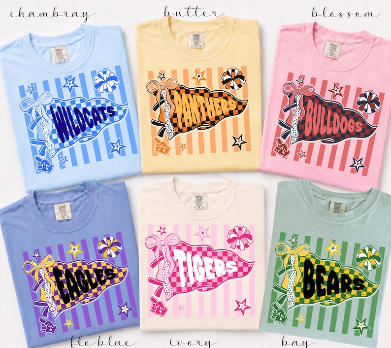 May include: Six short-sleeve crew neck t-shirts in light blue, yellow, pink, periwinkle, ivory, and sage green. Each shirt features a graphic of a pennant flag with a team name, including Wildcats, Panthers, Bulldogs, Eagles, Tigers, and Bears.