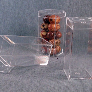 Acrylic box with short lid for display, 2 5/8 tall x 1 3/16 wide on all four sides