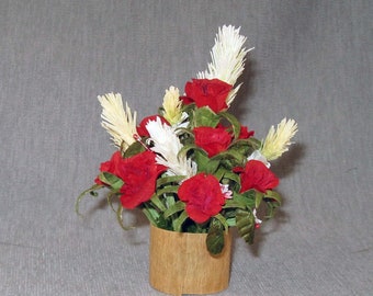 Red Roses and Pampas grass floral arrangement in beige vase inside acrylic box