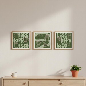 May include: Three framed art prints with a coffee theme. Each print features green illustrations of coffee-making equipment and the words "MORE ESPRESSO", "LESS DEPRESSO". The frames are a light brown color.