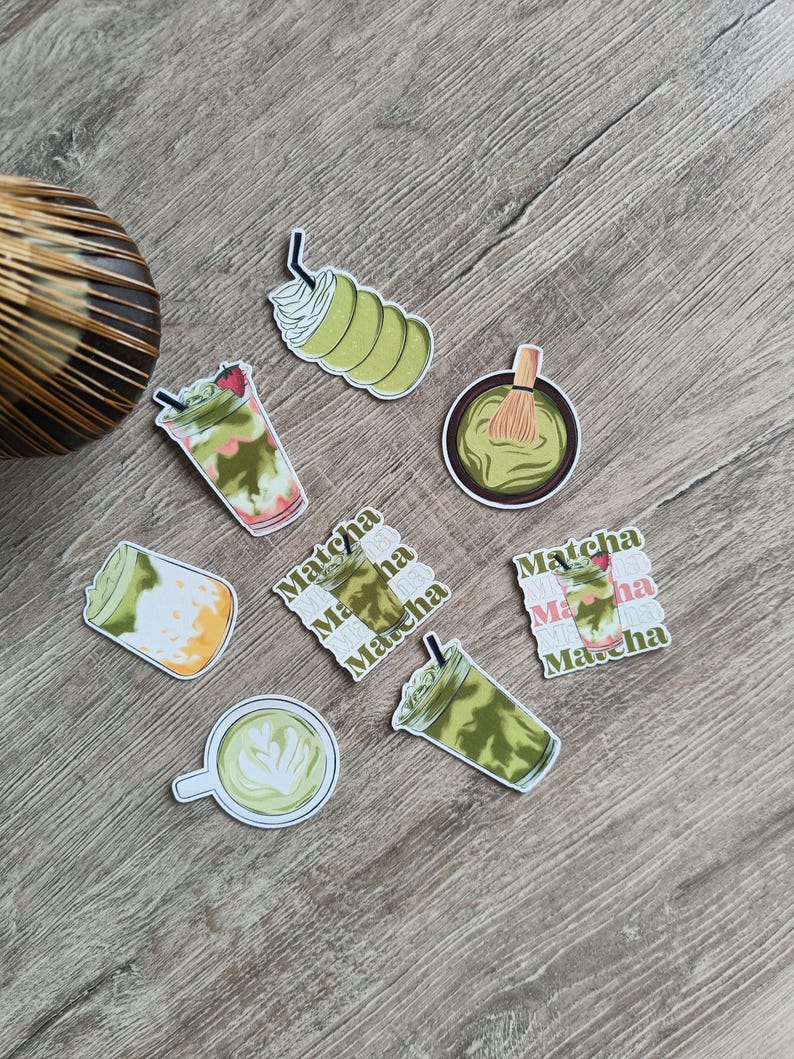 May include: A collection of matcha-themed stickers featuring various matcha drinks, including a latte with latte art, a matcha latte with a strawberry, and a matcha drink with whipped cream. The stickers also include a bowl of matcha and a matcha whisk.