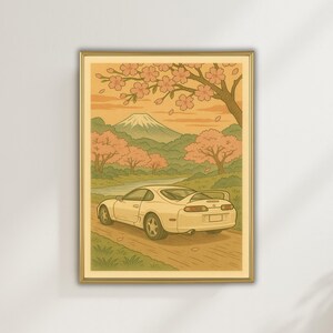 Könnte beinhalten: Ein weißer Sportwagen fährt auf einer kurvigen Straße durch einen Kirschblütenwald mit dem Fuji im Hintergrund.