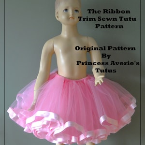 May include: A pink tulle tutu with multiple layers of pink satin ribbon trim. The tutu is worn by a mannequin. The text "The Ribbon Trim Sewn Tutu Pattern Original Pattern By Princess Averie's Tutus" is superimposed on the image.