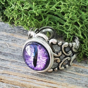 Bijoux Red Dragon Eye Ring Anneaux oculaires réglables Anneaux de dragon pour les femmes / hommes Charming Evil Attractive Ring Cadeau unique pour les hommes Violet