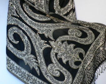 Indian shawl/scarf/stole.  Black and cream with Gold sequins.  Man made fibre. 85" x 27"  216 x 72 cm