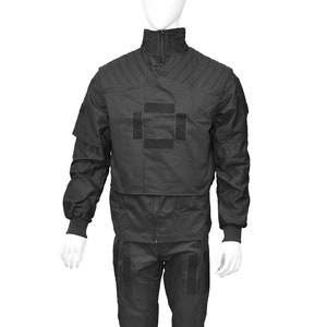 May include: Black tactical suit with a zipper closure and multiple pockets. The suit has a large velcro patch on the chest.