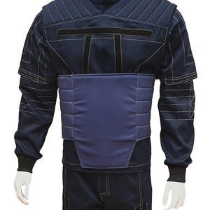 May include: A dark blue jumpsuit with a padded chest piece and white stitching. The jumpsuit has a high collar and long sleeves.