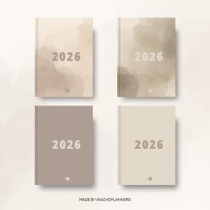 May include: Four hardcover planners for the year 2026, each with a different neutral color cover. The covers feature a watercolor wash design in shades of beige, taupe, and gray. The year 2026 is printed in a large, sans-serif font.