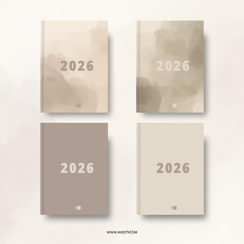 May include: Four hardcover journals, each with "2026" printed on the cover. The journals are in shades of beige, tan, and taupe, with a watercolor-like design. The bottom of the image displays the website address www.wachd.be.