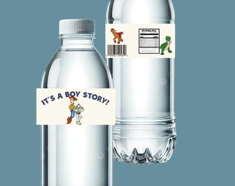 May include: Two clear plastic water bottles with white caps. One bottle has a label that says "IT'S A BOY STORY!" with cartoon characters. The other bottle has a label with a barcode, a horse, a dinosaur, and the words "Birthday Boy".