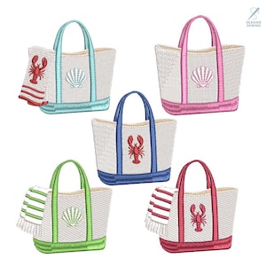 May include: Embroidered tote bags in various colors, each featuring a beach theme. Designs include a seashell or lobster, with matching towels. The bags have colored handles and trim, perfect for a day at the beach.