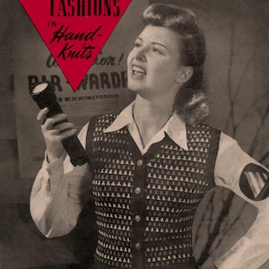 May include: A black and white magazine cover featuring a woman wearing a knitted vest with buttons. The magazine is titled "Victory Fashions in Hand-Knits" and the cover text reads "Vest No. 310 See Page 10".