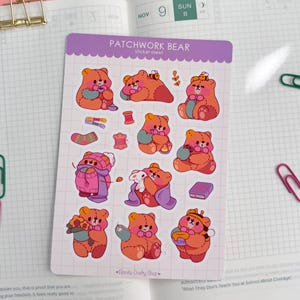 May include: A sticker sheet featuring various cartoon bear designs in shades of orange and pink. Each bear is depicted in different poses, some holding objects like flowers, books, and spools of thread. The sheet is labeled "PATCHWORK BEAR sticker sheet."