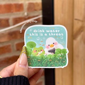 Drink Water This Is a Threat Matte Waterproof Sticker Vinyl| Funny Hydration Reminder Decal| Duck & Frug Kawaii Sticker for Laptop, Planner
