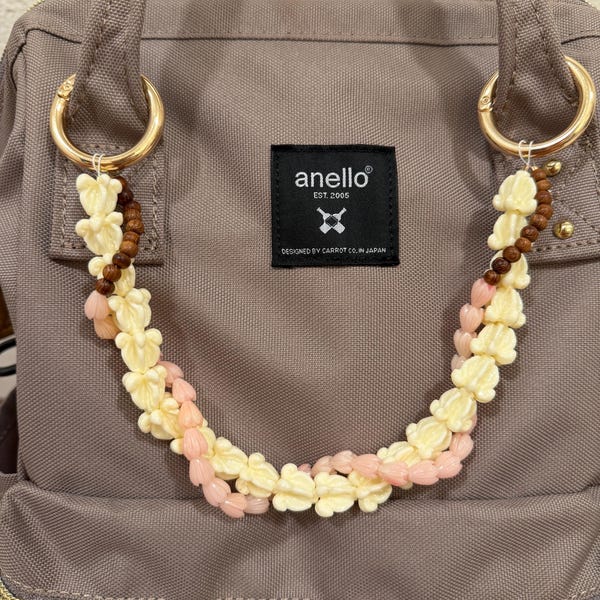 Pink Pikake and Pua Kalaunu Purse Lei