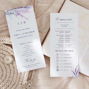 May include: Two wedding programs with lavender floral designs. The left program lists the couple's names and wedding details. The right program details the bridal party and the day's schedule. Both are on a neutral background.