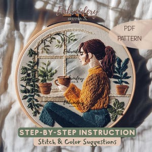 May include: An embroidery hoop featuring a detailed stitched design of a person sitting by a window, holding a cup. The person is wearing a yellow sweater and blue pants. The design includes plants in pots and the text "PDF PATTERN" and "STEP-BY-STEP INSTRUCTION Stitch & Color Suggestions".