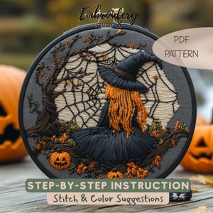 May include: A circular embroidery hoop containing a hand-stitched scene of a witch with orange hair and a black hat sitting before a spider web. The design includes a dark tree, small orange pumpkins, and text reading Embroidery STUDIO X, PDF PATTERN, STEP-BY-STEP INSTRUCTION, Stitch & Color Suggestions.