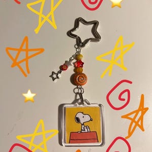 orange snoopy photo album trinket keychain