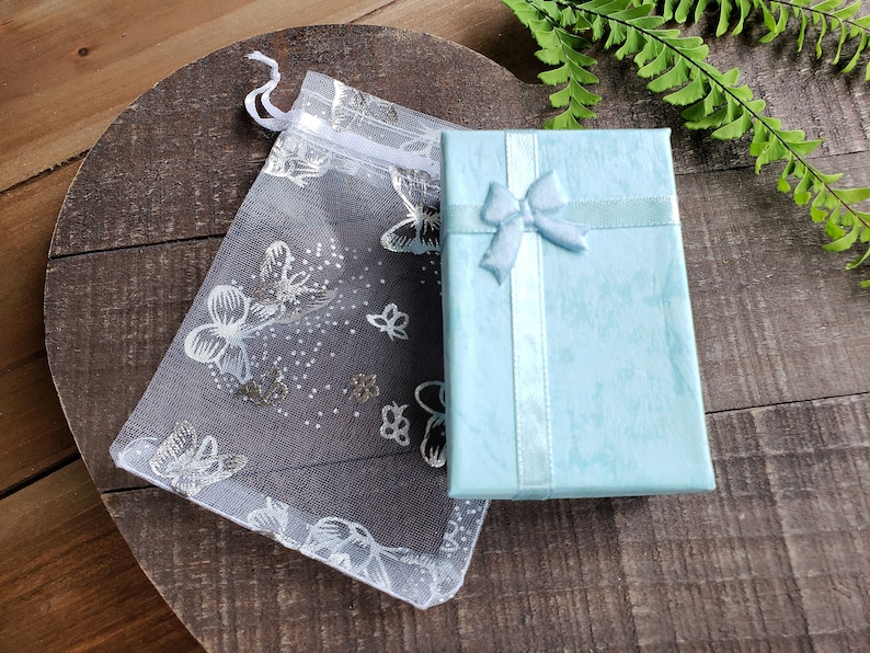 All purchases are lovingly packaged in a small turquoise gift box, safely enclosed in delicate white butterfly organza bag.