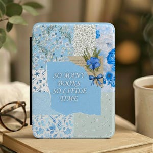 May include: An e-reader case with a blue and white floral patchwork design. The case has the text "SO MANY BOOKS SO LITTLE TIME." A bouquet of blue flowers is tied with a blue ribbon. The case is designed to protect an e-reader.