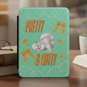 May include: A teal tablet case featuring the words "PRETTY & WITTY" in orange, a white kitten illustration, orange bows, and star accents. The case has a textured finish and a black spine.
