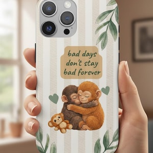 May include: A white ceramic mug with a black handle and the text "But First, Coffee" in a bold, black font. The mug is set against a blurred background, suggesting a cozy setting.