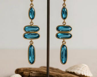 Tidebeam Earrings | Faceted Ocean Blue Crystal Dangles – Gold Tone Statement Earrings - Beach Inspired Jewelry