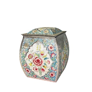 May include: A decorative box with a silver lid and a floral design. The box is painted with a variety of colors, including blue, pink, yellow, and green. The floral design is intricate and detailed, and the box is a beautiful example of traditional craftsmanship.