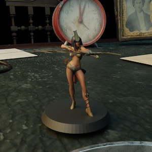 May include: A figurine of a woman archer in a gold and beige outfit, holding a bow and arrow. The figure is on a dark gray base. A large red clock is in the background.