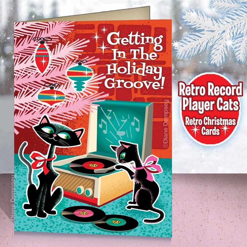 May include: A retro Christmas card featuring two black cats with pink bows, listening to a record player. The card has the text "Getting In The Holiday Groove!" and "Retro Record Player Cats". Ornaments and a Christmas tree are in the background.