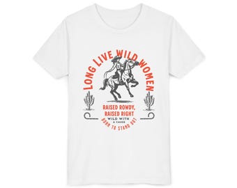 May include: A white short-sleeve t-shirt featuring a graphic print with a person riding a horse, two cacti, and the text: LONG LIVE WILD WOMEN, RAISED ROWDY, RAISED RIGHT, WILD WITH A CAUSE, BORN TO STAND OUT. The design uses black and red ink.
