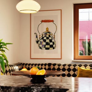May include: A framed print of a decorative teapot with a black and white checkered pattern, gold accents, and a wooden handle. The artwork hangs above a black and white diamond-patterned bench in a kitchen setting.