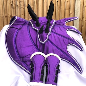 Beautiful Saddle Pad Set Dragon Wing Glittery Purple Matching Ear Bonnets with Horns Sparkling Rhinestone on Edges and Brushing Boots.